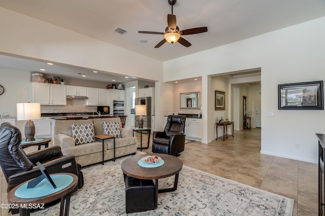 living room with baseboards, a ceiling fan, recessed lighting, and visible vents