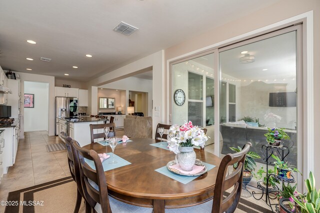 dining area with recessed lighting, visible vents, and light tile patterned flooring