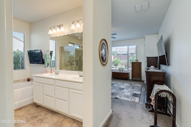 full bath featuring visible vents, a sink, a garden tub, and a stall shower
