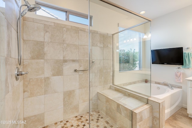 full bathroom featuring a bath and a stall shower