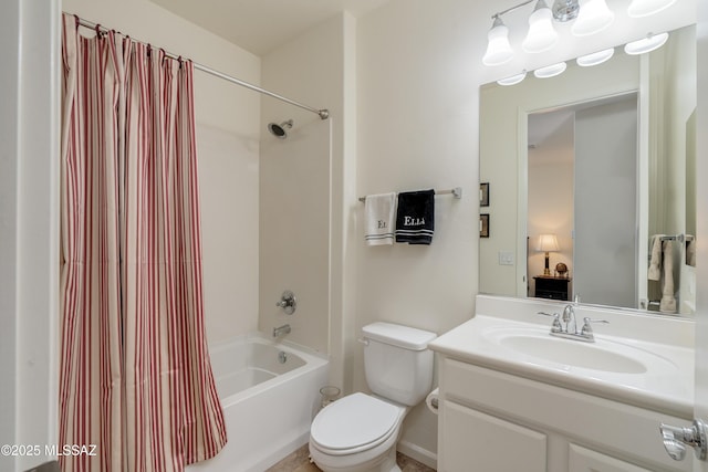 full bath featuring vanity, toilet, and shower / tub combo