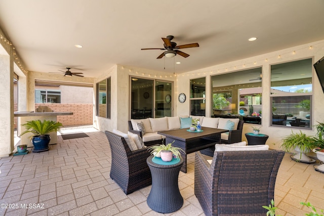 2594 E Keyes Ct, Green Valley, AZ 85614 - view of patio / terrace featuring an outdoor hangout area, ceiling fan, exterior kitchen, and a fenced backyard