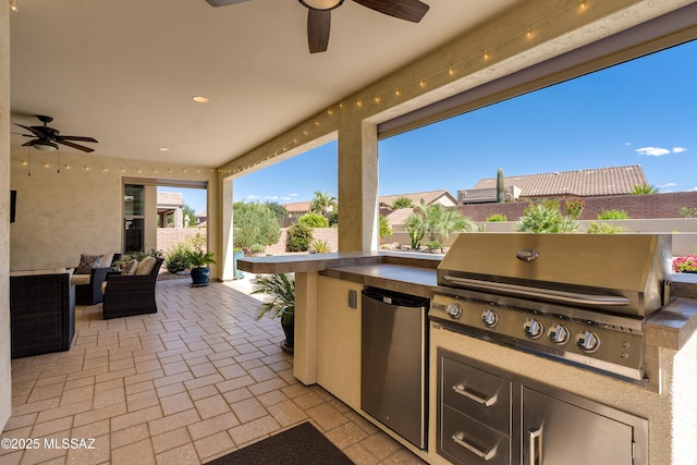 view of patio / terrace with a ceiling fan, area for grilling, and a grill