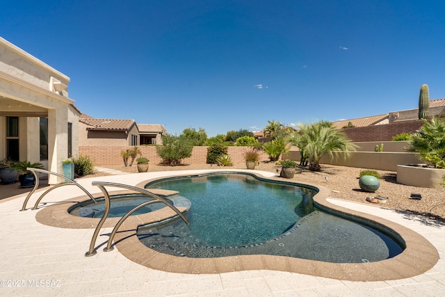 view of pool featuring a fenced in pool, a fenced backyard, and a patio area