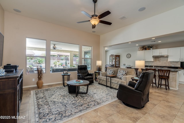 living room with visible vents, a ceiling fan, and recessed lighting