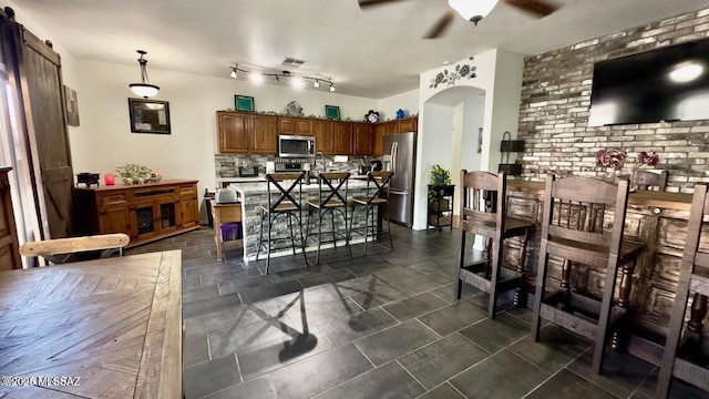 630 E Racine Pl, Casa Grande, AZ 85122 - dining room with visible vents, a ceiling fan, and arched walkways
