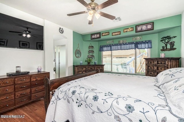 630 E Racine Pl, Casa Grande, AZ 85122 - bedroom with visible vents, a ceiling fan, arched walkways, and wood finished floors