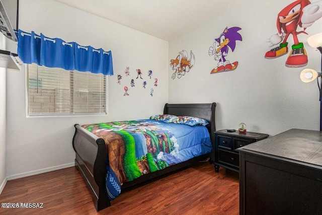 630 E Racine Pl, Casa Grande, AZ 85122 - bedroom featuring baseboards and wood finished floors