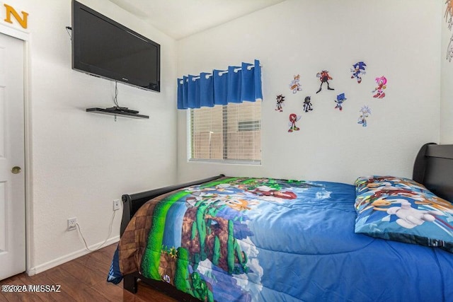 630 E Racine Pl, Casa Grande, AZ 85122 - bedroom featuring baseboards and wood finished floors