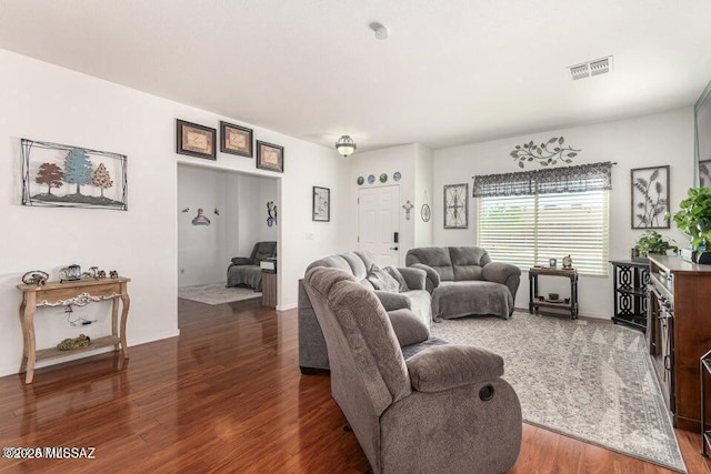 630 E Racine Pl, Casa Grande, AZ 85122 - living area featuring baseboards, visible vents, and wood finished floors