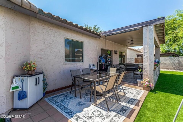 630 E Racine Pl, Casa Grande, AZ 85122 - view of patio / terrace with fence, a ceiling fan, and outdoor dining area