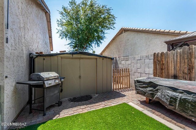 630 E Racine Pl, Casa Grande, AZ 85122 - view of yard with a storage shed, fence, and an outdoor structure
