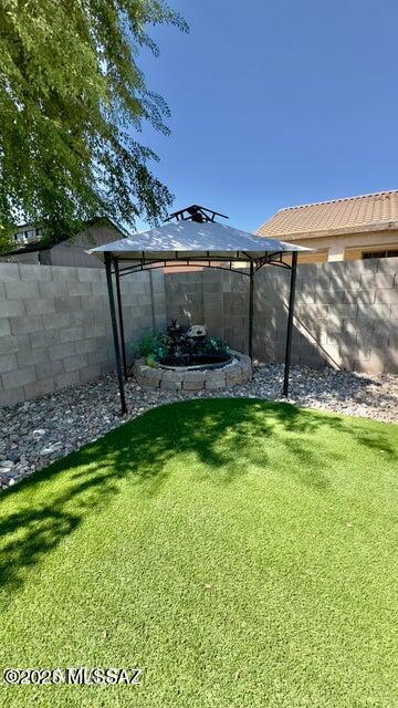 630 E Racine Pl, Casa Grande, AZ 85122 - view of yard featuring a gazebo and a fenced backyard