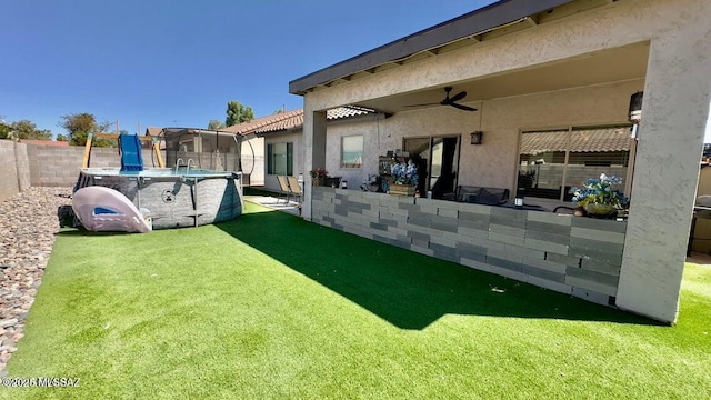 630 E Racine Pl, Casa Grande, AZ 85122 - view of yard with a fenced backyard, a fenced in pool, and ceiling fan