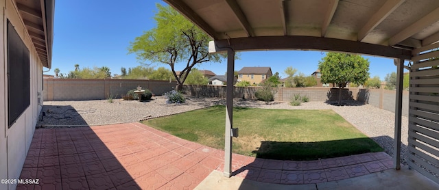view of yard with a fenced backyard and a patio area