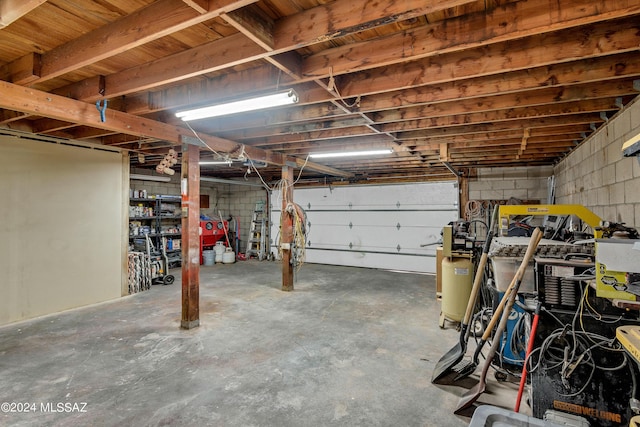 garage with concrete block wall