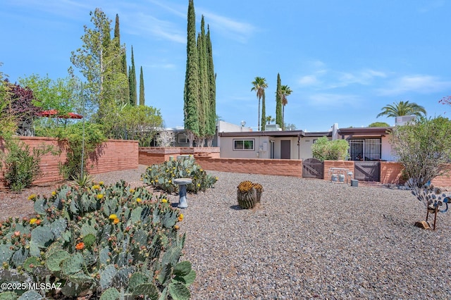 view of front of home with fence and stucco siding