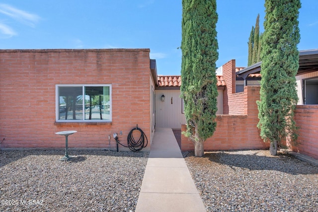 view of front of house featuring fence
