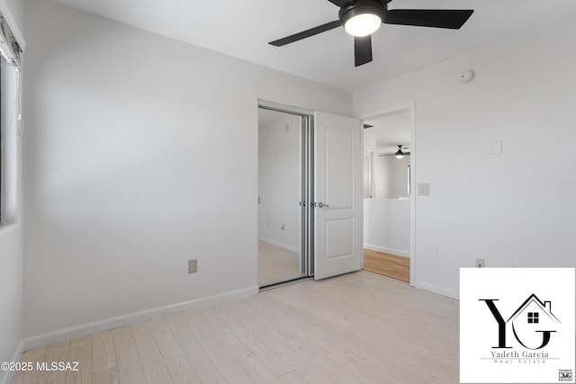 unfurnished bedroom with baseboards, ceiling fan, and light wood-type flooring