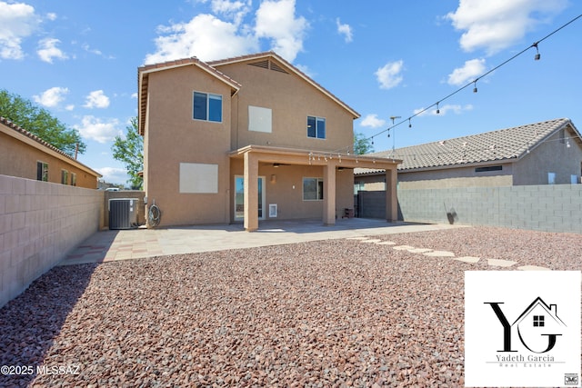 rear view of property with central air condition unit, a fenced backyard, a patio area, and stucco siding