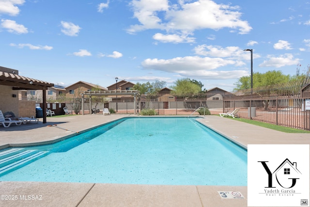 community pool featuring a pergola, fence, a residential view, and a patio