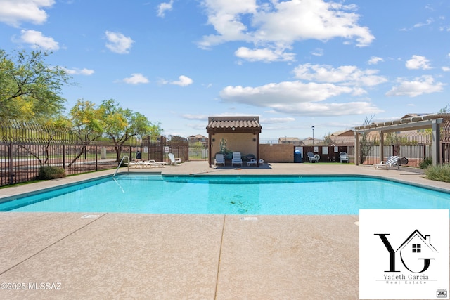 pool featuring a pergola, fence, and a patio