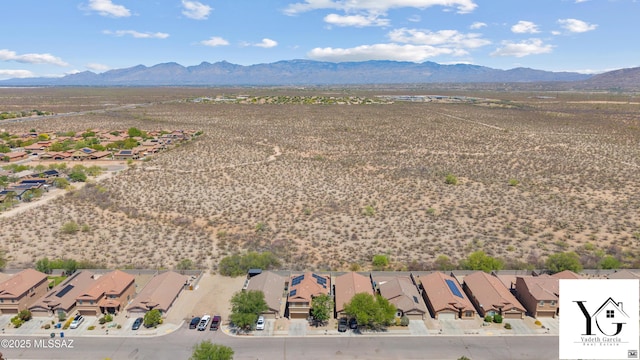 bird's eye view featuring a residential view, view of desert, and a mountain view