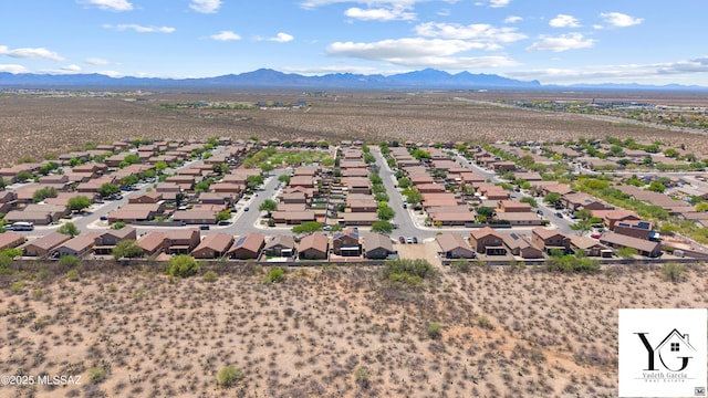 bird's eye view with a mountain view, view of desert, and a residential view
