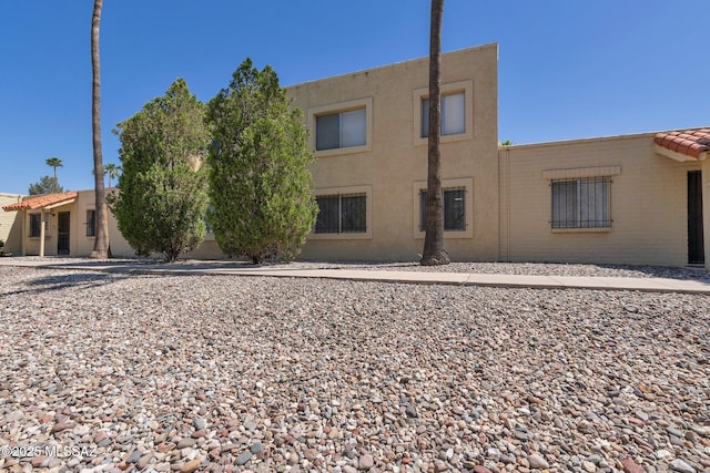 back of house featuring stucco siding