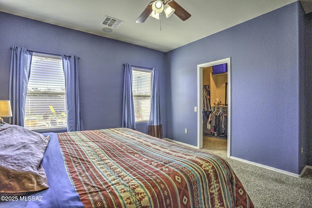 33925 S Alvarado St, Red Rock, AZ 85145 - bedroom with visible vents, carpet, a textured wall, and a spacious closet