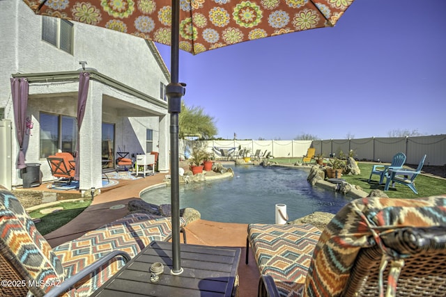 33925 S Alvarado St, Red Rock, AZ 85145 - view of patio / terrace with a fenced in pool, a fenced backyard, and outdoor dining space