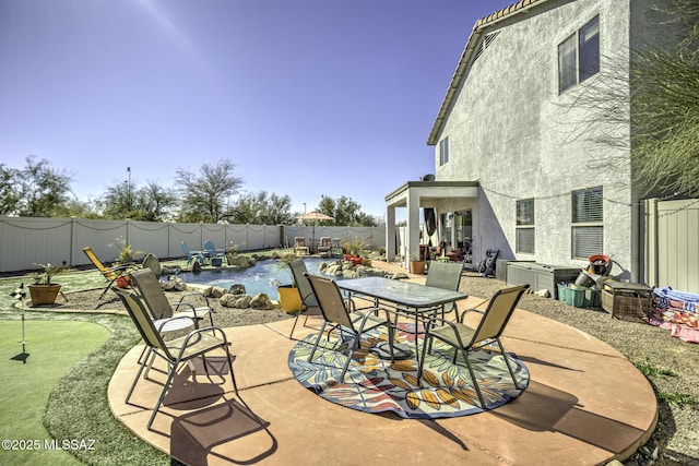 33925 S Alvarado St, Red Rock, AZ 85145 - view of patio / terrace with a fenced backyard and outdoor dining area