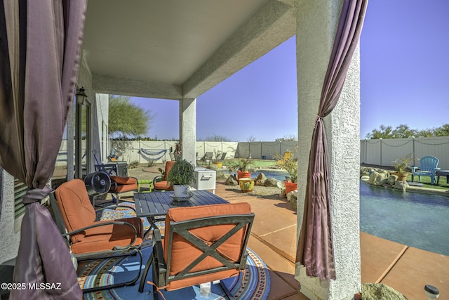 33925 S Alvarado St, Red Rock, AZ 85145 - view of patio featuring a swimming pool, a fenced backyard, and outdoor dining space