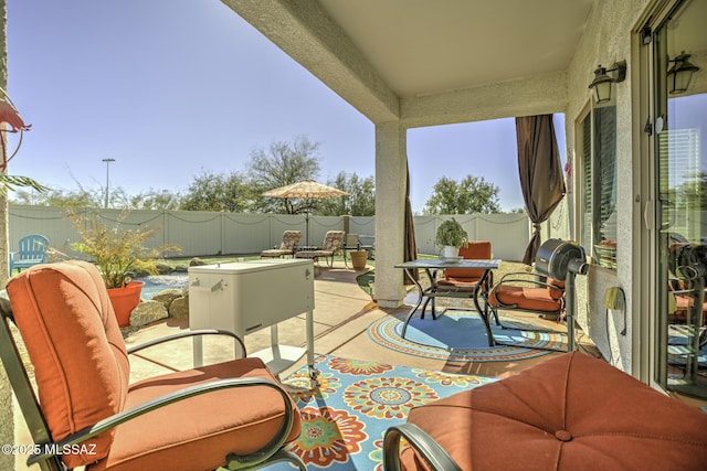 33925 S Alvarado St, Red Rock, AZ 85145 - view of patio featuring outdoor dining area and a fenced backyard