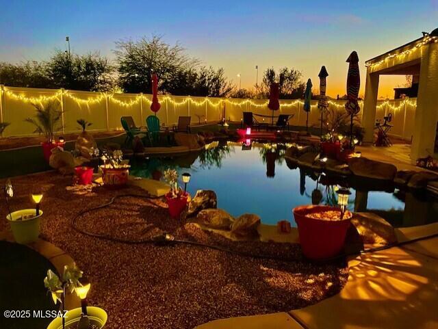 33925 S Alvarado St, Red Rock, AZ 85145 - view of swimming pool with a fenced in pool, fence, and a patio area