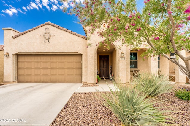 7084 W Cliff Spring Trl, Marana, AZ 85658 - view of front of house featuring stucco siding, a garage, driveway, and a tiled roof