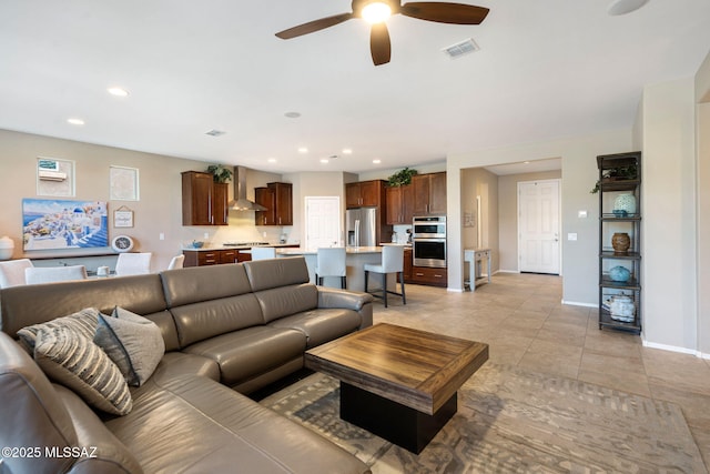 7084 W Cliff Spring Trl, Marana, AZ 85658 - living room featuring a ceiling fan, baseboards, recessed lighting, and light tile patterned floors