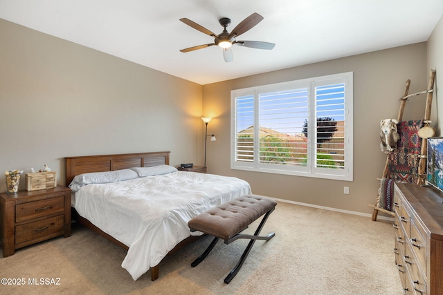 7084 W Cliff Spring Trl, Marana, AZ 85658 - bedroom featuring light carpet, baseboards, and ceiling fan