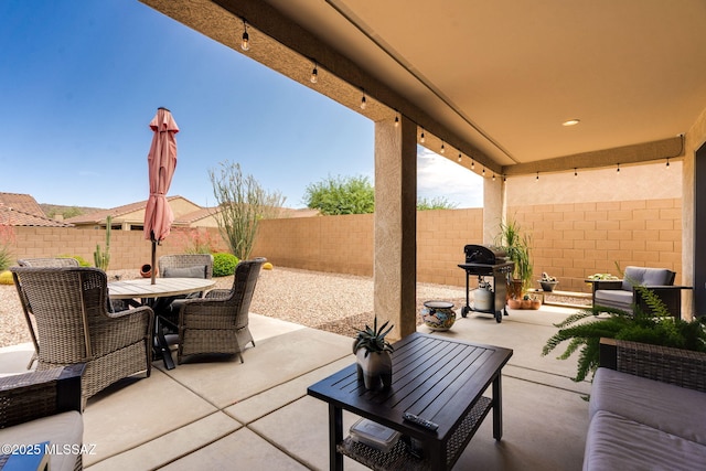 7084 W Cliff Spring Trl, Marana, AZ 85658 - view of patio / terrace featuring grilling area, outdoor dining space, and a fenced backyard