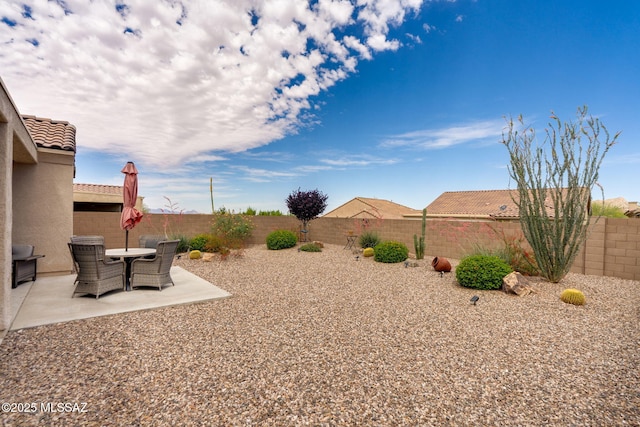 7084 W Cliff Spring Trl, Marana, AZ 85658 - fenced backyard with a patio