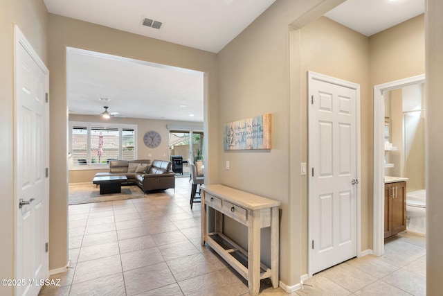 7084 W Cliff Spring Trl, Marana, AZ 85658 - corridor with light tile patterned floors and baseboards