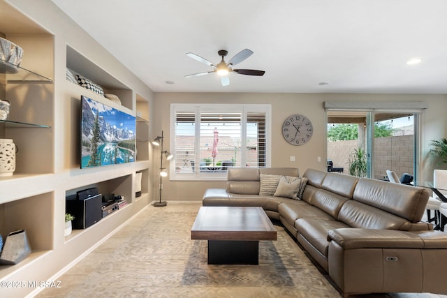 7084 W Cliff Spring Trl, Marana, AZ 85658 - living area featuring built in shelves, ceiling fan, baseboards, and recessed lighting