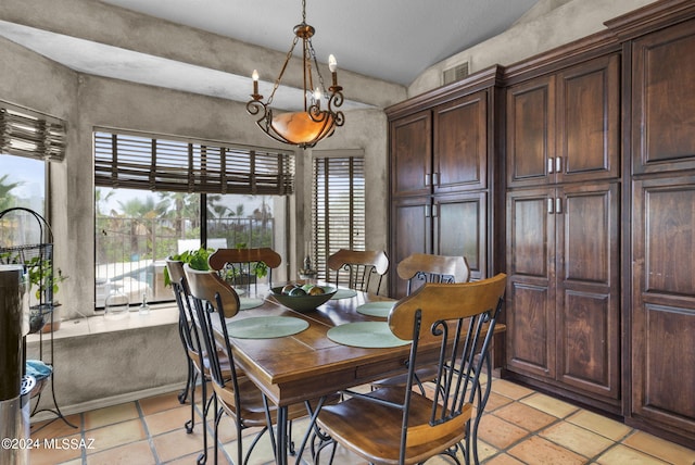 dining room featuring a notable chandelier and visible vents