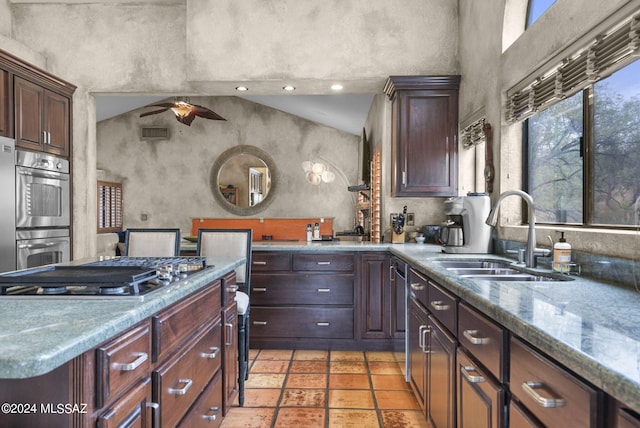 kitchen featuring visible vents, a sink, ceiling fan, and stainless steel appliances