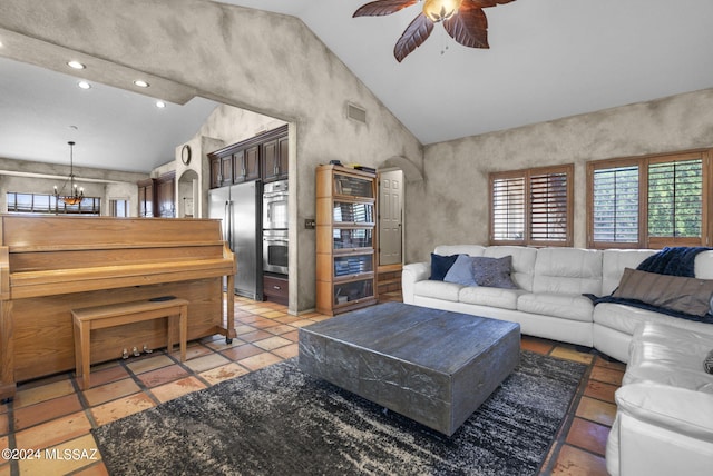 living room with ceiling fan with notable chandelier, vaulted ceiling, and recessed lighting