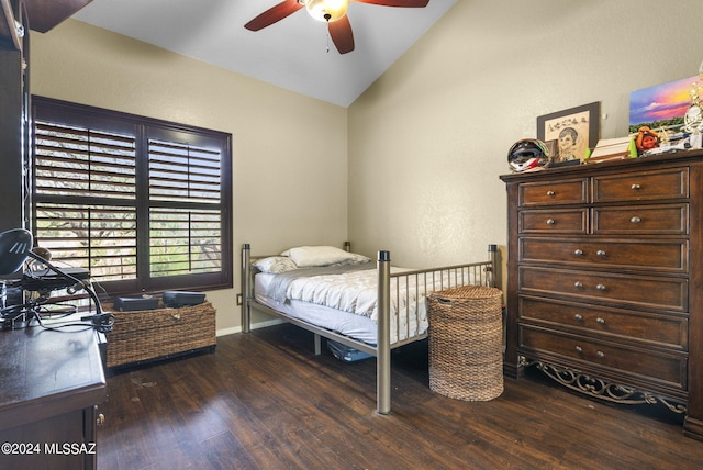 bedroom featuring wood finished floors, baseboards, ceiling fan, and lofted ceiling