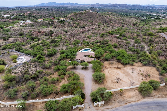 bird's eye view featuring a mountain view and view of desert