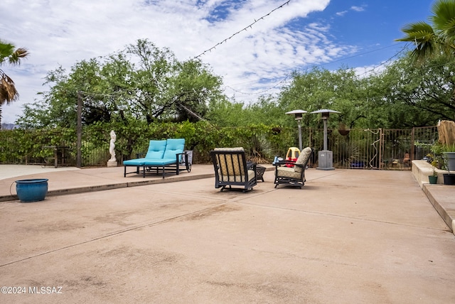 view of patio with fence and an outdoor hangout area