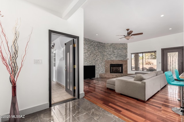1330 W Panorama Rd, Tucson, AZ 85704 - living room featuring a stone fireplace, a ceiling fan, baseboards, and recessed lighting