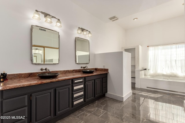 1330 W Panorama Rd, Tucson, AZ 85704 - bathroom featuring visible vents, a sink, marble finish floor, and double vanity